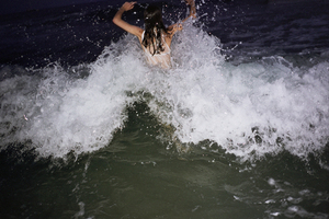 swimming in the sea at night