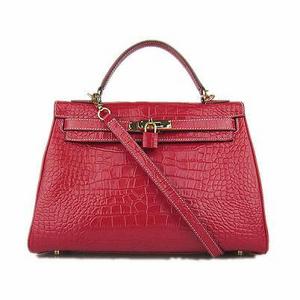 темная сумка типа Hermes Kelly