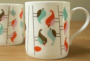 cup with birds