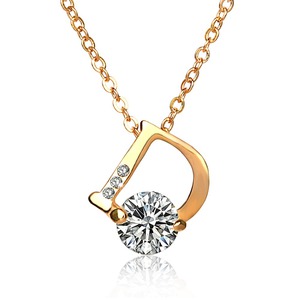 Letter D pendant in yellow gold with diamond on a long chain