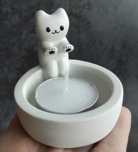 Подставка подсвечник котик греет лапки