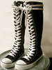 Black and white sneaker boots