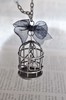 Silver tone Bird Cage with a cute little bird inside Kitsch pendant necklace