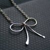 SILVER BOW necklace