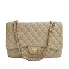Бежевая сумка Chanel 2.55