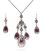 OZON.ru - Подарки | Комплект "Графиня", ожерелье и серьги от Avon. Искусственные рубины, стразы, металл цвета "черненое серебро"