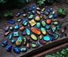 Самоцветы. Не украшения, а именно камушки, можно маленькие и горсткой. Нравятся лунный камень, лабрадорит, хризопраз, аквамарин, лазурит, черный авантюрин. Всякие зелёные, синие, голубые, многоцветные подойдут.