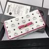MCM Bow Visetos Trifold Leather Long Wallet In White