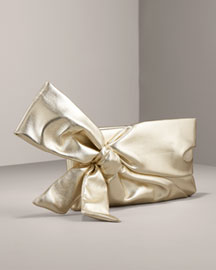 Valentino Laminated Leather Bow Clutch or smth like this