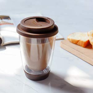 Glass travel mug with silicone lid